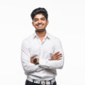 indian-business-man-with-crossed-hands-posing-isolated-white-wall